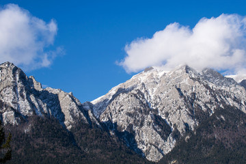 Fototapeta premium Caraiman mountain, Caraiman cross covered by clouds, Bucegi, Romania