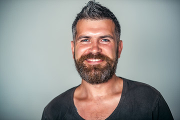 Man happy smile on bearded face with stylish haircut