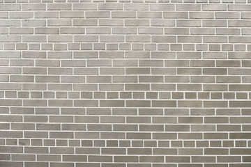 Old grey brick wall background texture