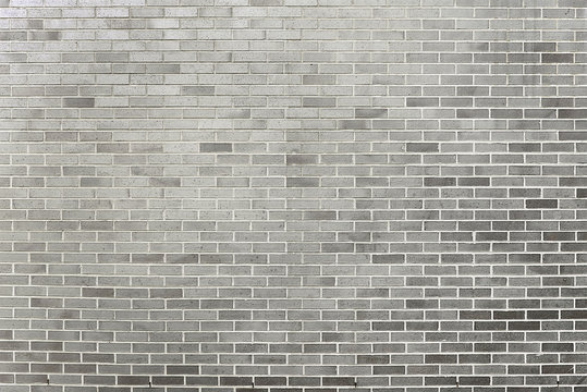 Old grey brick wall background texture © issalina