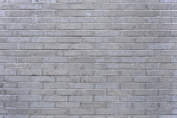 Old grey brick wall background texture