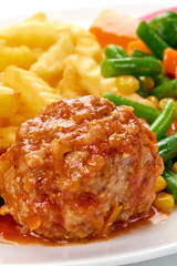 Meat ball in tomato sauce with potatoes fries, close-up, isolated on white background