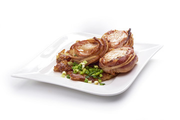 Pork fillet wrapped in bacon, isolated on white background