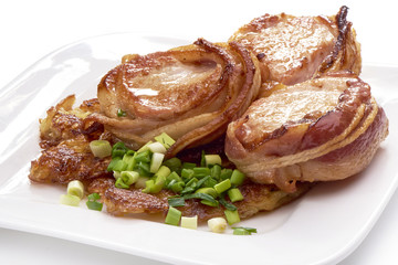 Pork fillet wrapped in bacon, isolated on white background