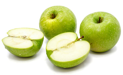 Sliced apple Granny Smith, two whole and two halves, isolated on white background 