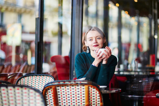 Elegant French Woman In Parisian Cafe