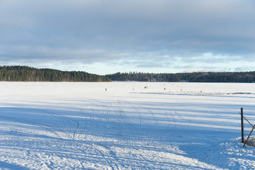 Fototapeta na wymiar Ice rink on the frozen lake in Finland