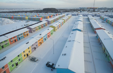 The aerial view to the small village with bright coloured townhouses