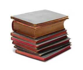 Stack of old antique big books isolated on white background