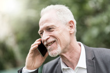 Mature man talking on mobile phone