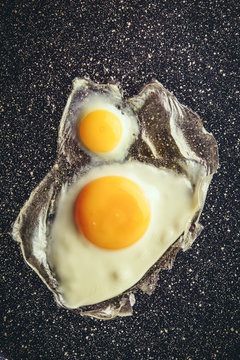 Eggs fried on pan