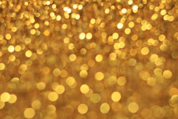 Gold bokeh glitter abstract light background 