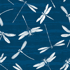 White silhouettes of dragonflies on a textured background. Seamless vector pattern. Art nature background.