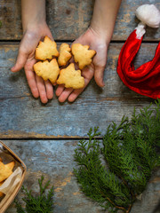  cookies in the shape of a Christmas tree and a star, Christmas decorations on a wood background. Merry Christmas.