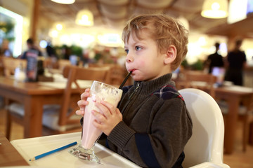 Kid has milkshake