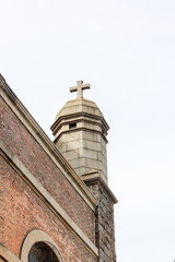  Close up image of the Cross on top of the Shrine Church of St. Anthony of Padua, located at 155 Sullivan Street, Soho.