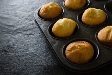 Plain cupcakes on baking tray
