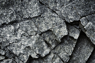 a dark cracked piece of granite