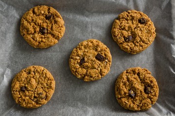 Freshly baked cookies on wax paper