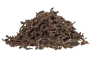 Dry tea leaves isolated on a white background, close up
