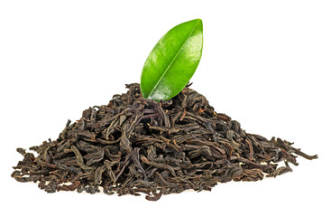 Dry black tea with green leaf isolated on white background