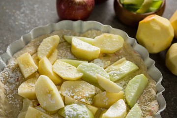 Slice of apple on tart with icing sugar