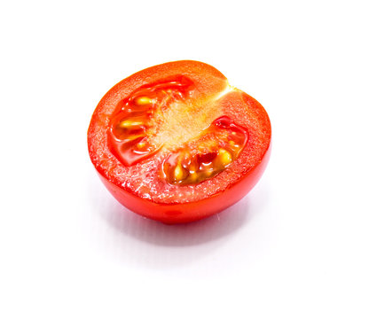 One Red Cherry Tomato Half With Seeds Isolated On White Background