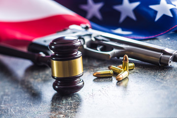 Judge gavel and gun bullets.