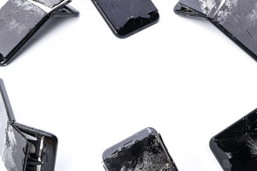 Frame of broken mobile phones, space for text