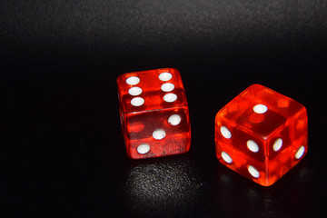 Red Casino Dice - Isolated Objects, Gambling in Reno Nevada, Throwing a Six and One, Black Background