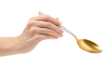 Female hand holding a spoon