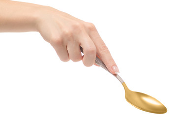 Female hand holding a spoon