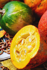 autumn still life, background for Thanksgiving or Halloween, colorful leaves and pumpkins, books and black tea, honey and biscuits, apples and chestnuts, warm atmosphere, wooden, fall