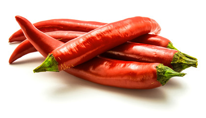 Group of four red Chili peppers isolated on white background