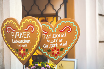 Austrian gingerbread hearts inscription on a heart shaped decoration in the center of Vienna, Austria