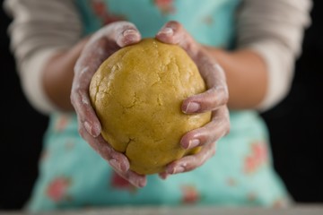 Woman holding a dough