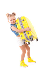 Attructive cute little girl in blue shirt, white shorts and sunglasses hold yellow suitcase