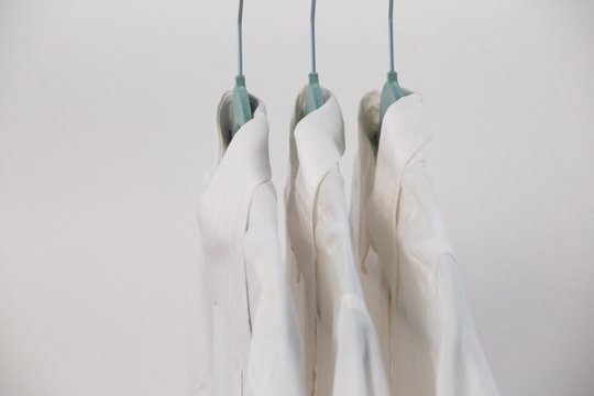 Close-up of shirts hanging on hanger