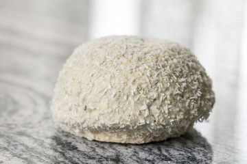 Fototapeta na wymiar Coconut cookie with chocolate on the grey granite background table