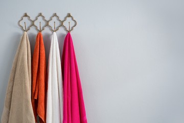 Colorful towels hanging on hook