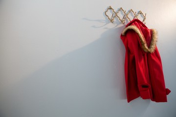 Red hoodie hanging on hook