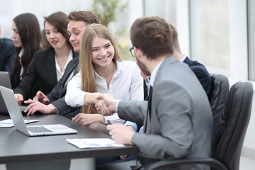 Fototapeta premium Manager and client greet each other with a handshake