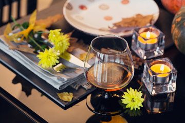Table setting with autumn decoration for Thanksgiving.