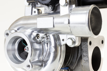new turbocharged car engine Isolated on a light background