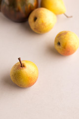 Fresh ripe yellow pears on light background.Autumn nature concept. Free space for text.