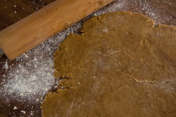 Flattened dough on a wooden table
