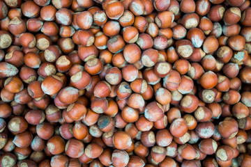 Hazelnuts. Food background. Stack of hazelnuts. Hazelnut background