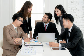 Group of multi-ethnic business partners discussing ideas in meeting room at office. Business people meeting corporate communication teamwork concept.