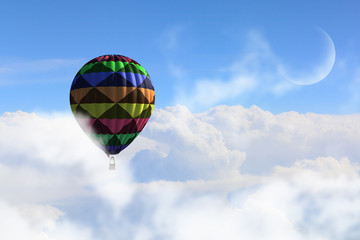 Fototapeta premium Aerostat floating in day sky. Mixed media