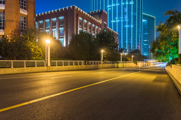 Fototapeta na wymiar city road through modern buildings in tianjin